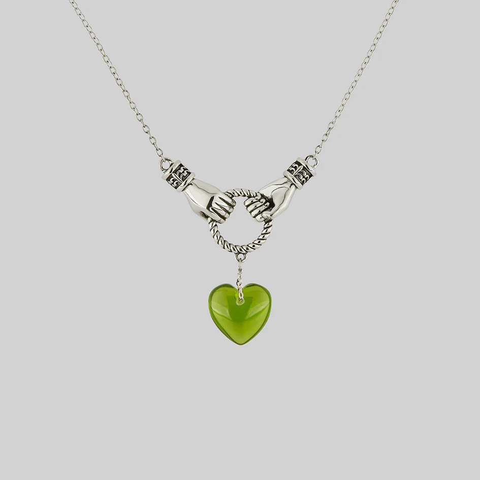 UNITE. Hand Grasping Green Glass Heart Necklace - Silver